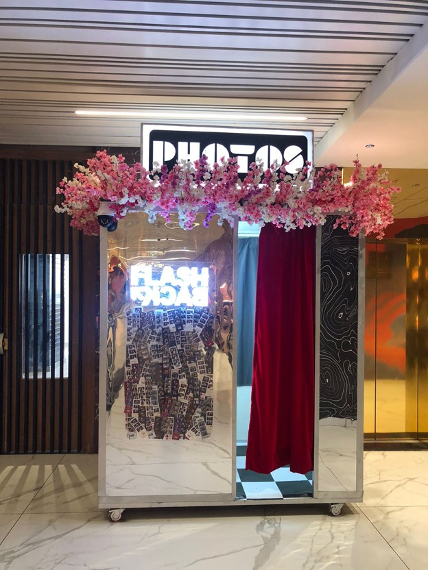 Mall photo booth setup with Flashback branding